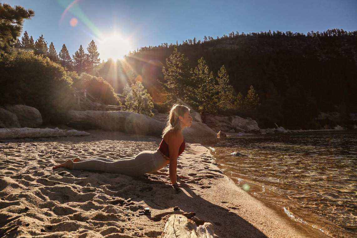 Jovanah practicing yoga at Hidden Beach, Lake Tahoe